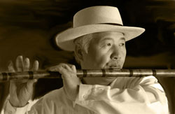 Ichi Lee playing the flute