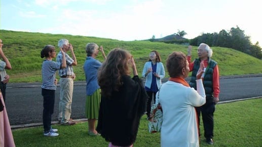 Ilchi Lee guiding meditation outside in New Zealand