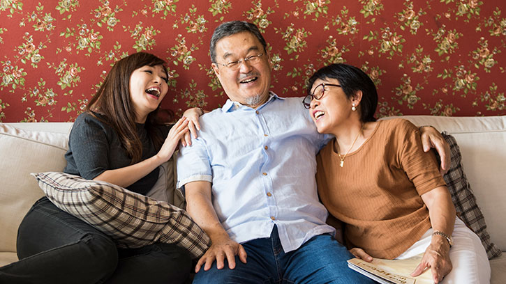 happy family sitting on couch